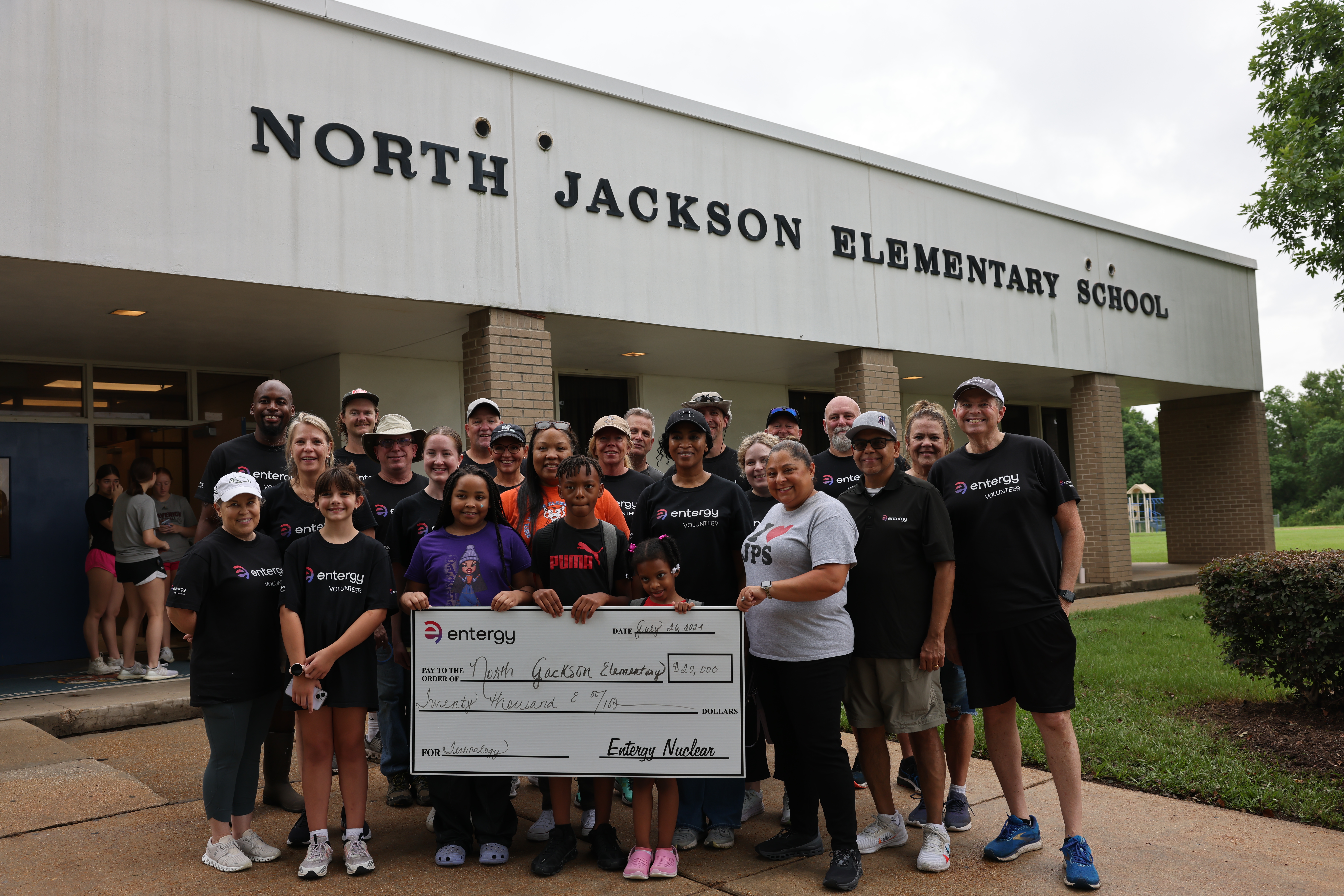 Volunteers gather for the grant presentation after a morning of beautifying North Jackson Elementary School.