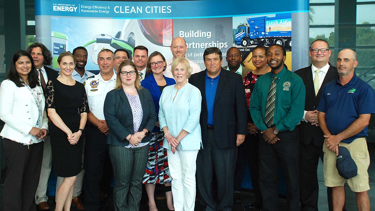 Byron Montgomery (sixth from right) accepted Entergy’s award at the Clean Fleet Award presentation.