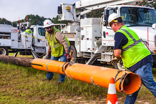 Entergy workers replace copper electrical wire with aluminum to improve safety and reliability.