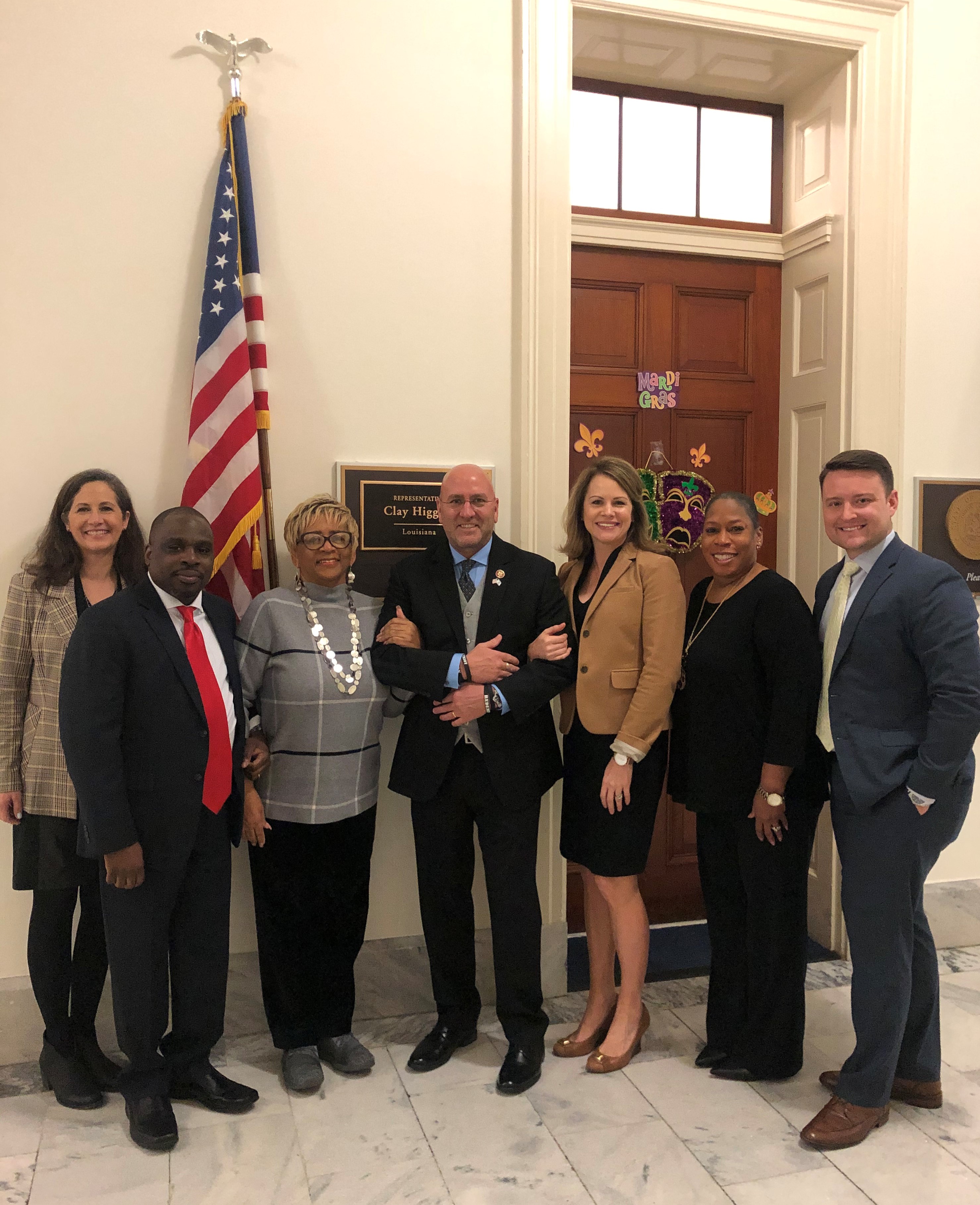 Team members with Louisiana Representative Clay Higgins (center).