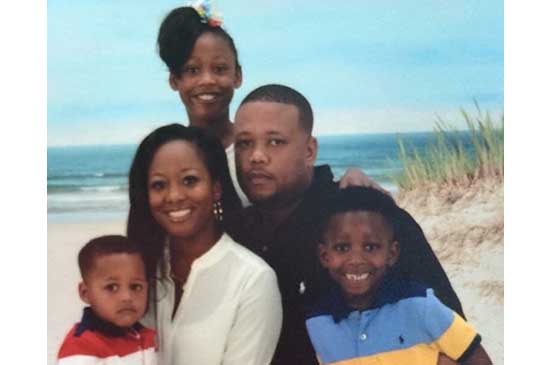 Fred with his wife, Neshia; youngest son, Fred; son, Dallas (standing); and daughter, Saniya