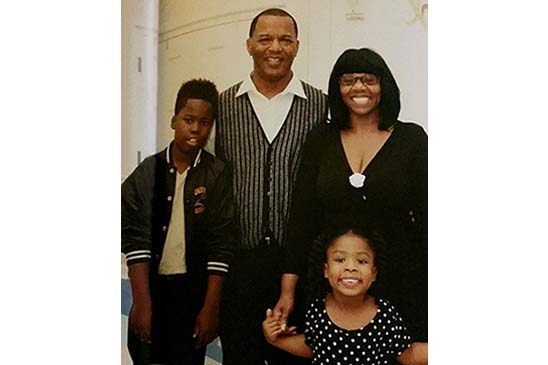 Gary C. Colar Sr., senior safety specialist in Entergy New Orleans’ gas distribution department,  with his wife Marie and their grandchildren, Kuhm (left) and Kory (right). 