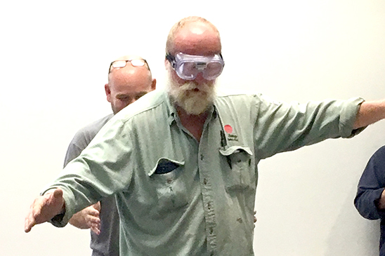 Lineman Dewy Andrews does his best to walk a straight line while wearing the disorienting goggles.  