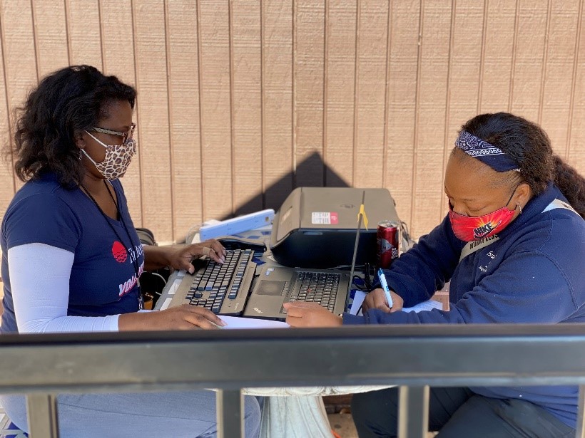 Jean Walker (left) has visited grocery stores throughout the New Orleans area to help employees apply for the United for Grocery Workers Relief Fund.