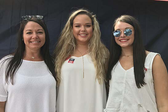 Hayley, pictured here with daughters Cally and Caitlyn, wants to go home each day knowing that she's done all she can to ensure the safety of her co-workers and customers.