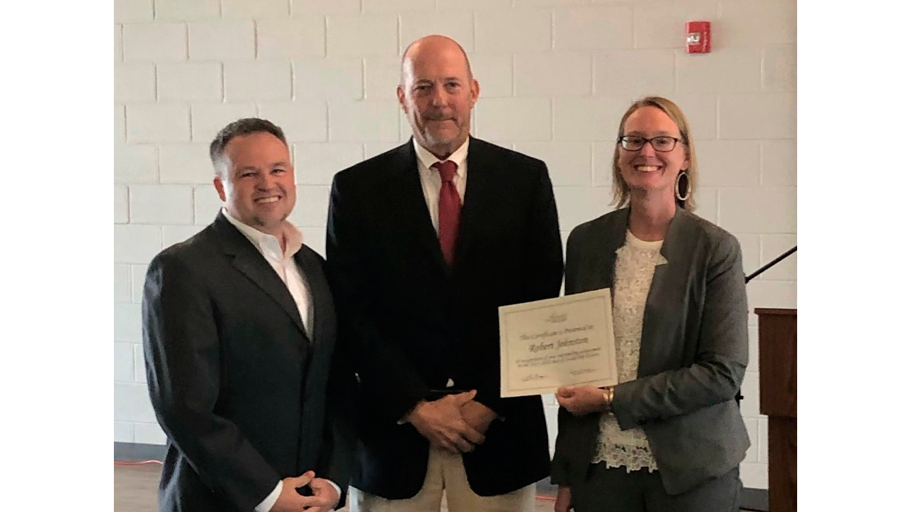 Customer Service Manager Robert Johnston (center) is a 2022 graduate of Leadership DeSoto.