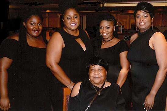 Nicole's family motivates her to work safely. From left to right: niece, Samira; sisters, Khalilah and A’Shevia; Nicole; and her mother, Dorothy (sitting)