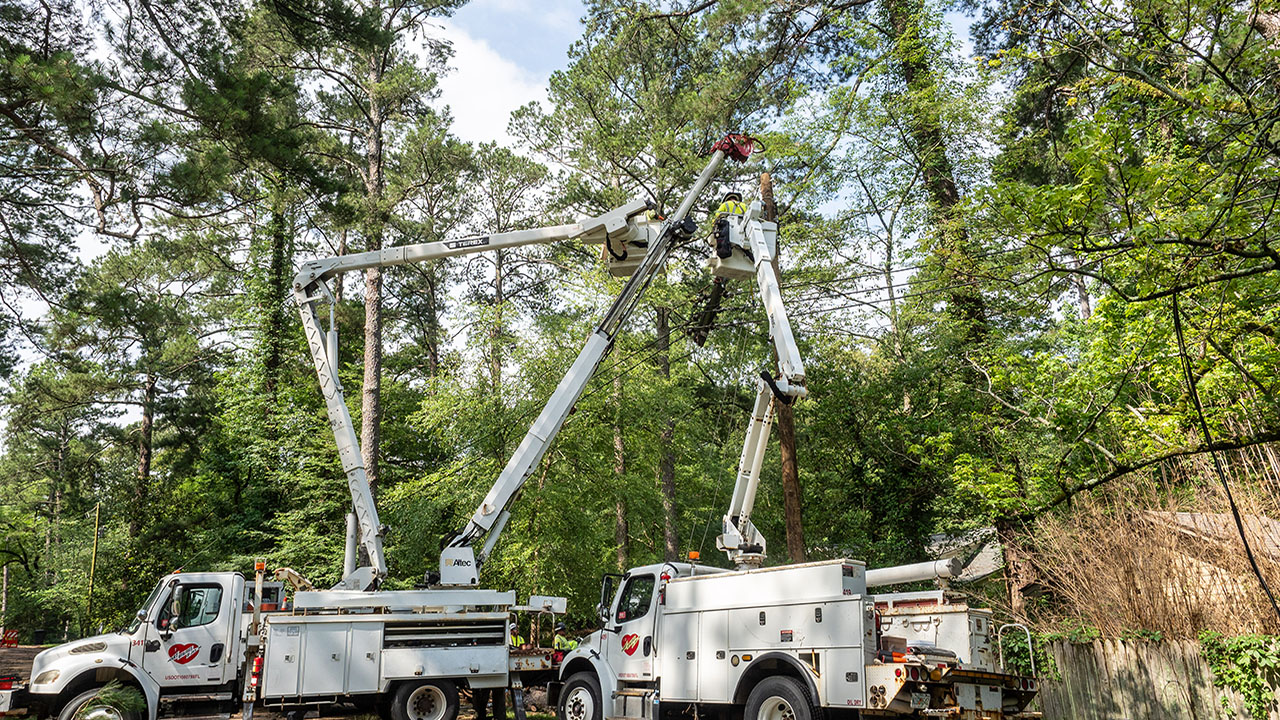 Crews replace poles along and near Northside Drive in Jackson, Mississippi.