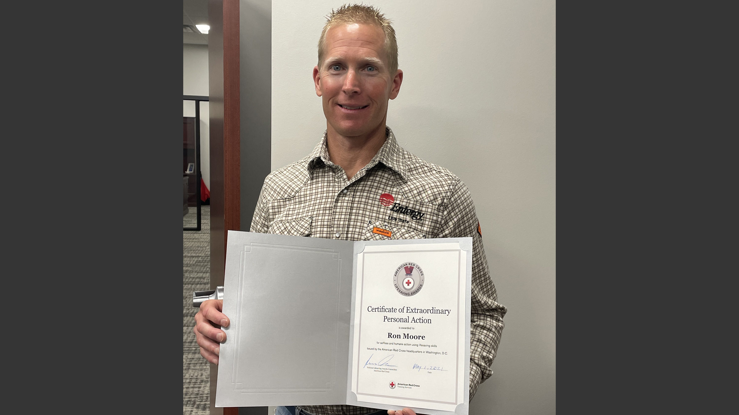 Ron Moore, Entergy Louisiana safety specialist, is pictured holding a lifesaving award from the American Red Cross. Ron Moore, Entergy Louisiana safety specialist, is pictured holding a lifesaving award from the American Red Cross.