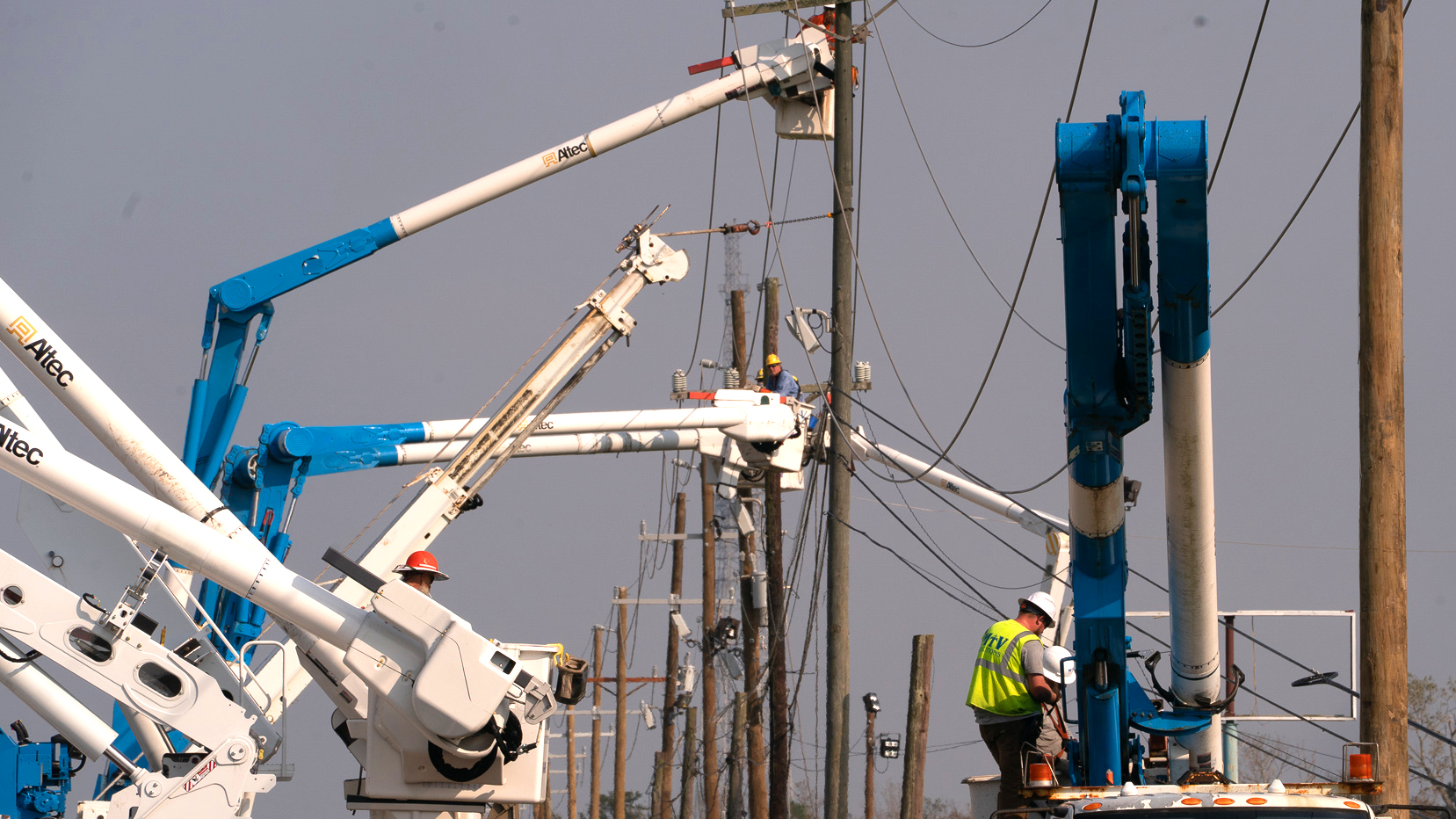Line workers restore power in the Destrehan/Reserve area Sunday.  