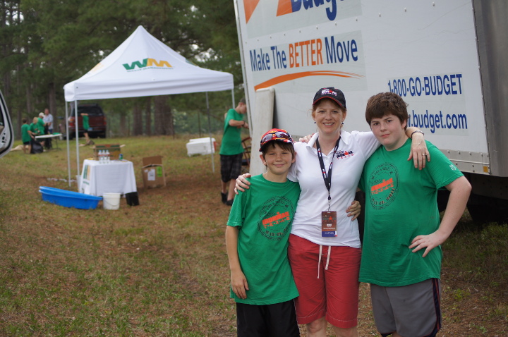 Entergy employee Dona Miller and her sons proudly volunteer for the Iron Man triathlon held annually in The Woodlands.