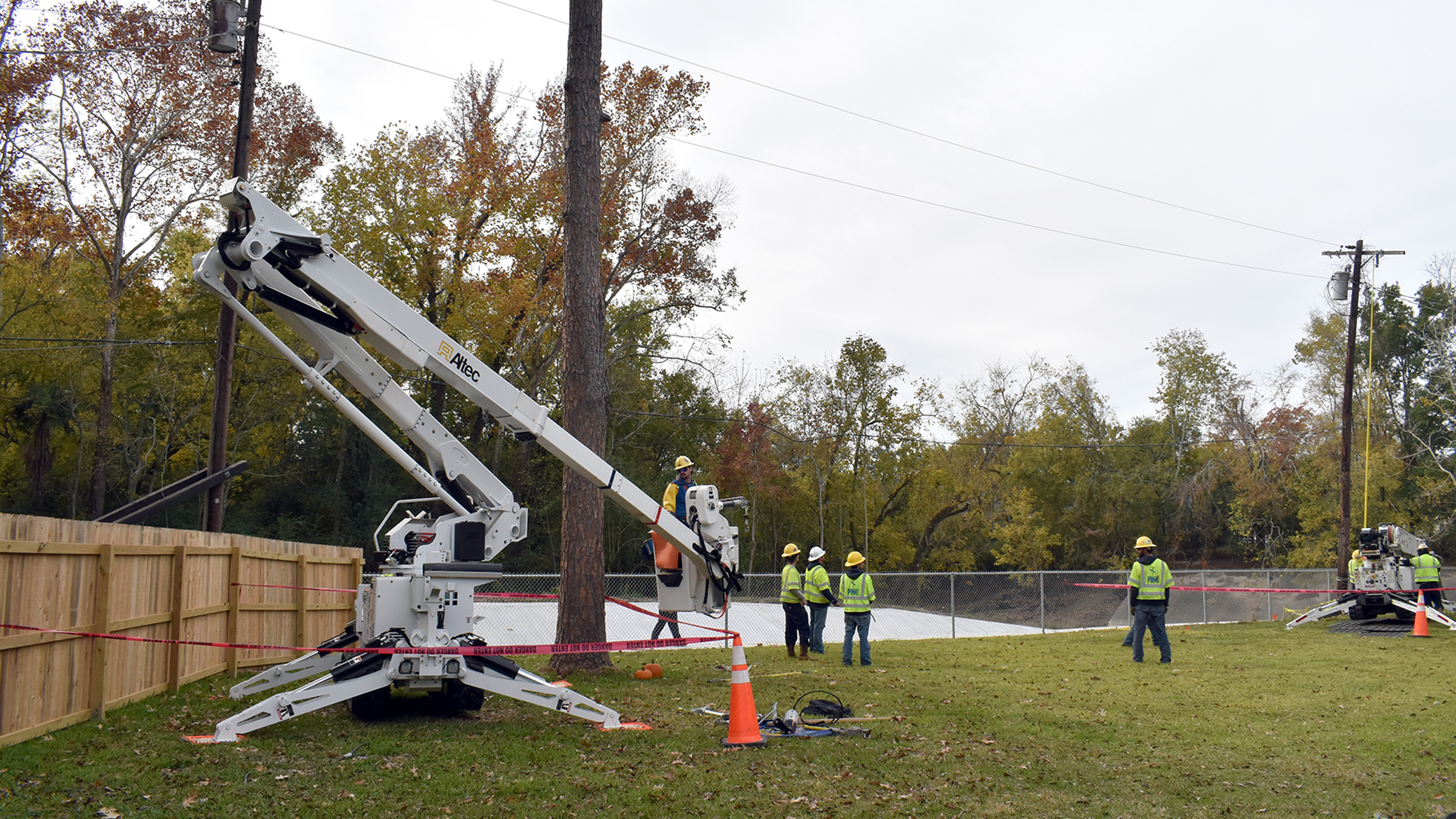 Pictured is a crew working in an alley behind a home in the Westminster area of Baton Rouge. 