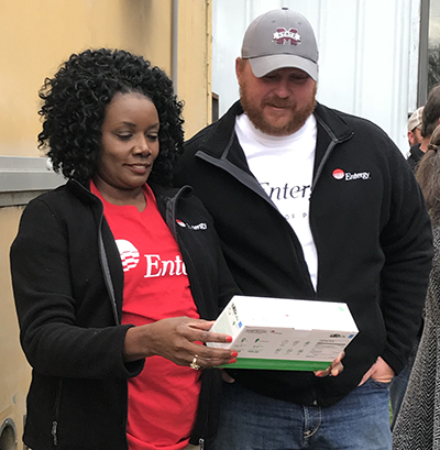 Entergy Mississippi employees distribute LED light bulbs at community events.
