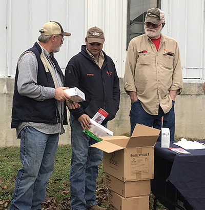 Entergy Mississippi employees distribute LED light bulbs at community events.