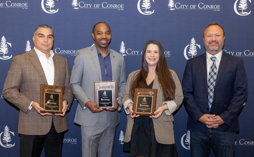 pictured left to right: stuart barrett, vice president of customer service (accepting the award on behalf of eliecer viamontes), kenny muhammad, regional customer service manager, corrin barrow, conroe customer service manager, and conroe city councilman howard wood