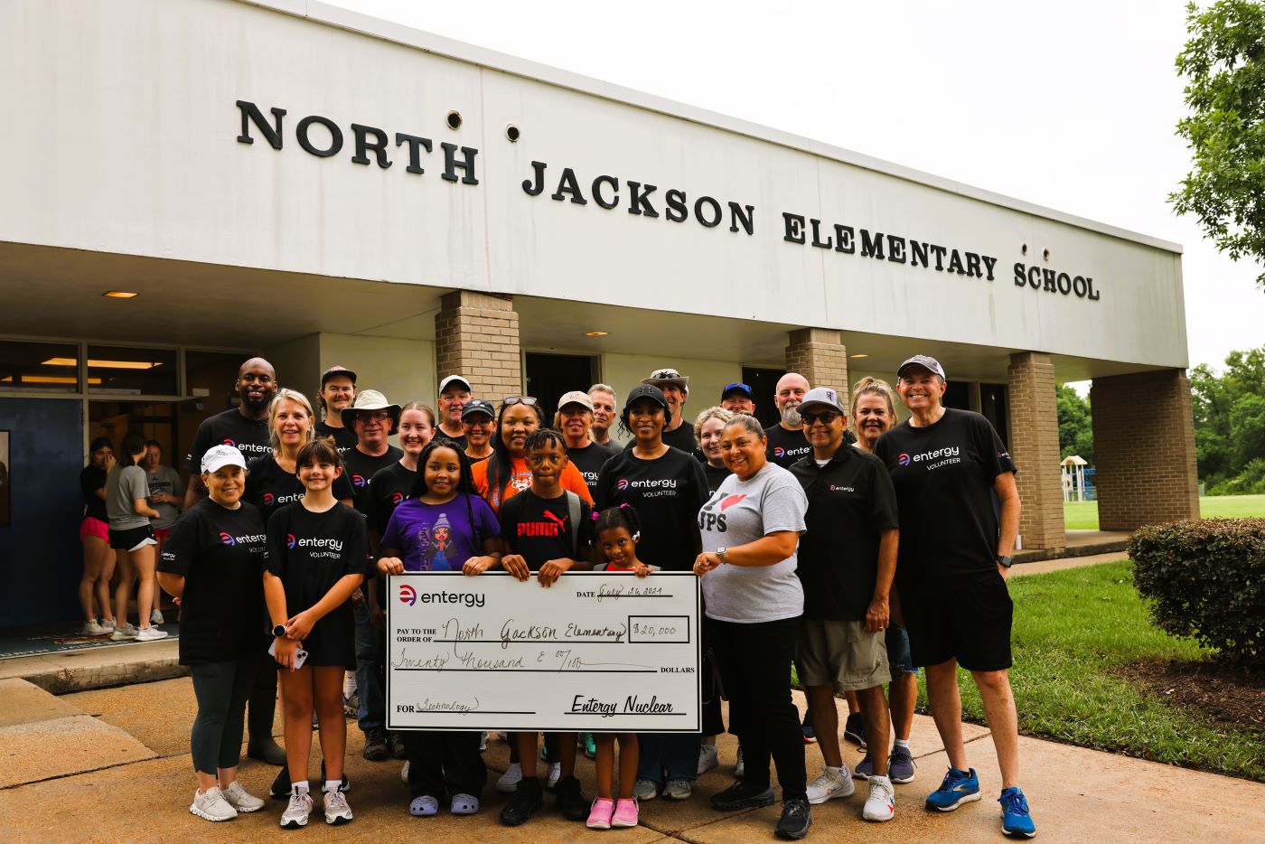 Volunteers gather for the grant presentation after a morning of beautifying North Jackson Elementary School.