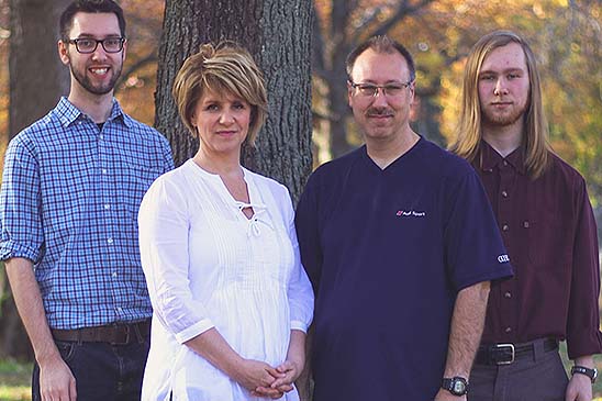 Doug's family motivates him to work safe. Left to right: son, Kevin; wife, Jody; Doug; and son, Alec.