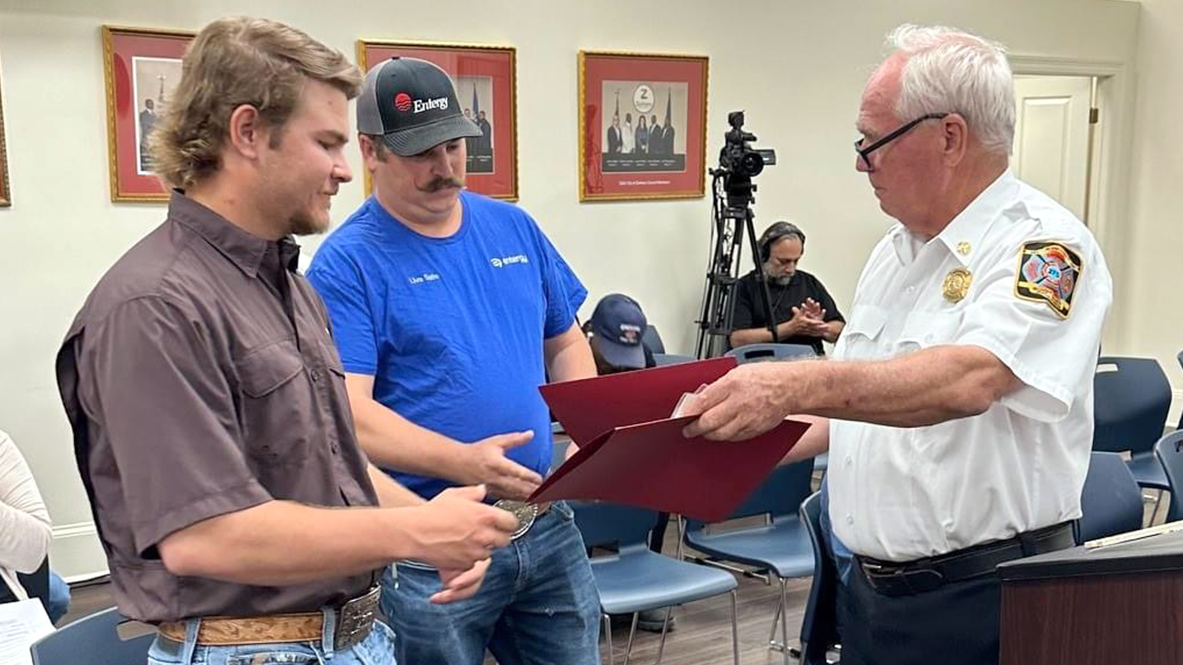 Caleb Harrell and Dylan Granger receive a Certificate of Commendation from the Zachary Fire Department for their heroic actions in rescuing two motorists from a burning vehicle.