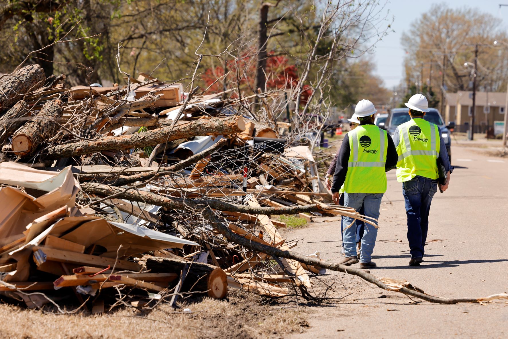 Crews work around debris piled up from the Wynne tornado.