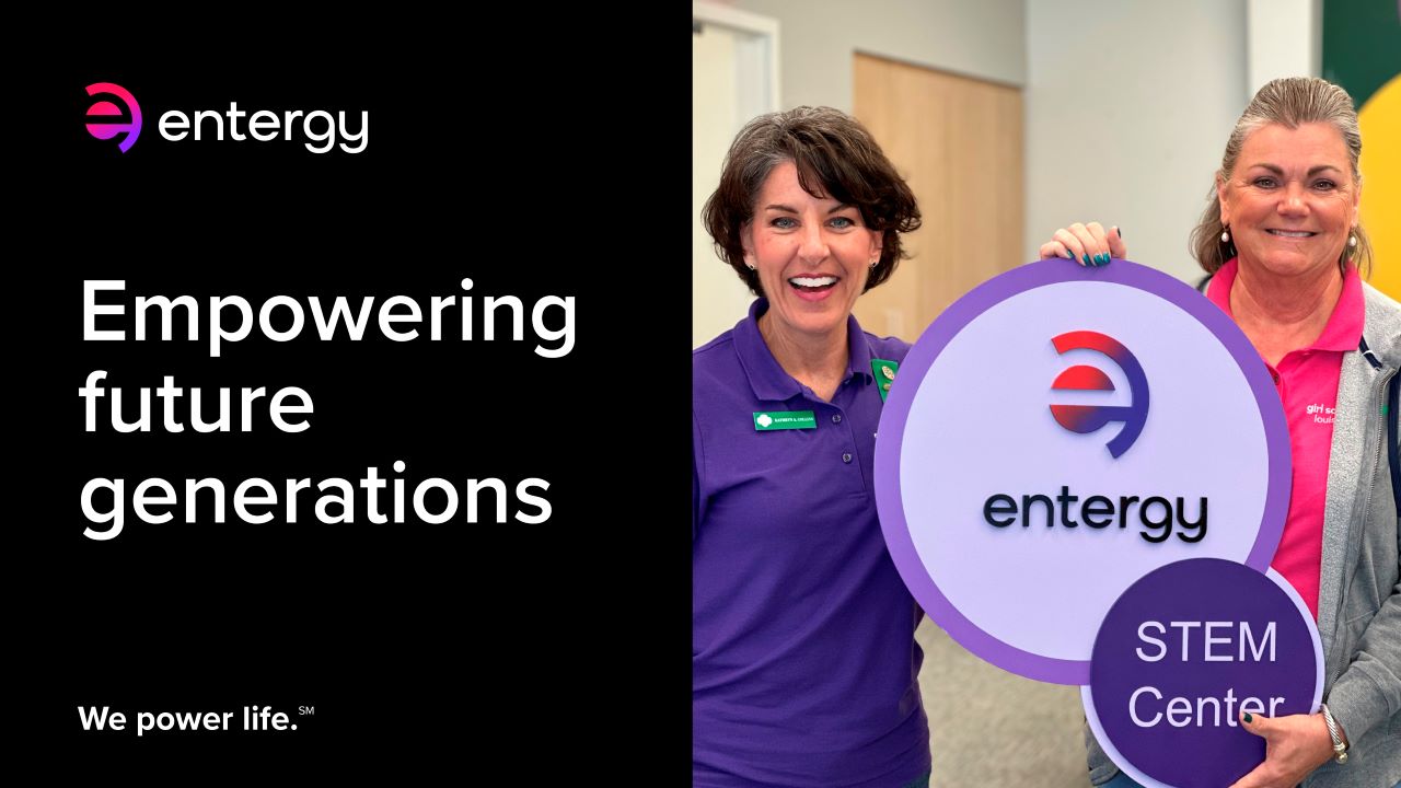 Kathryn Collins, Senior Vice President and Chief Human Resources Officer, Entergy and Dr. Rebecca Pennington, Chief Executive Officer, Girl Scouts Louisiana East, hold the naming sign for the Entergy STEM Center.