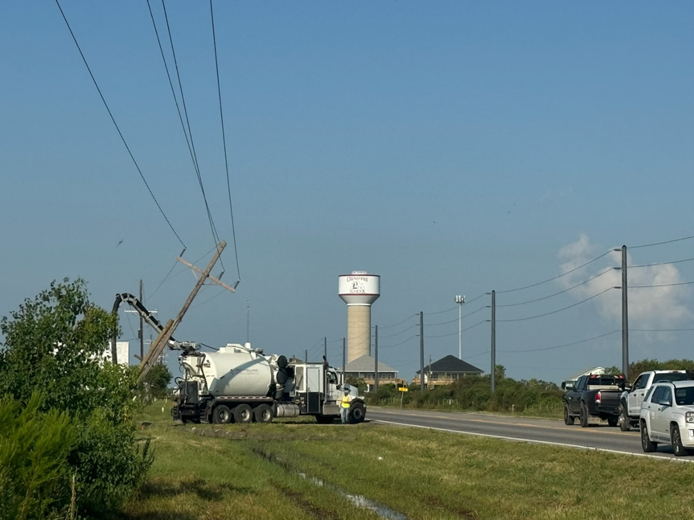 Pictured on the Bolivar Peninsula: On the left, wooden poles impacted by Hurricane Beryl, while the composite poles on the right remain unaffected. 