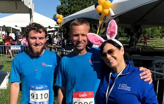 From left: Employees Drake Badeaux, Byron Grabert and Kim Mitchell enjoyed Entergy's hospitality tent in City Park after the race.