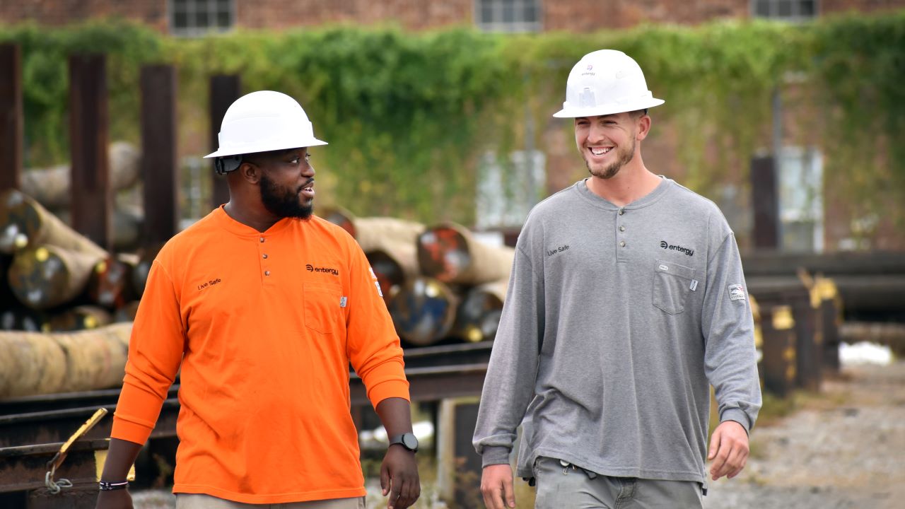 Entergy Louisiana lineworkers Nick White and Austin Eknoian walk through the company’s service center in Baton Rouge. 