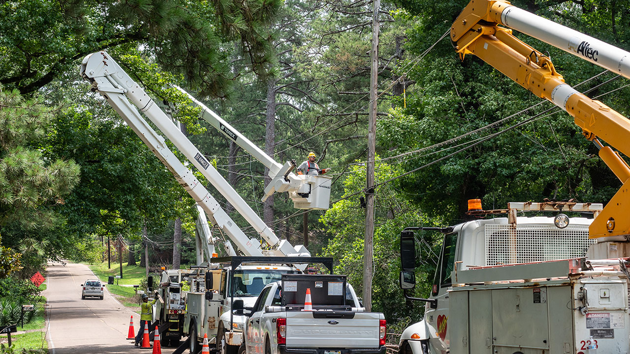 Crews work on Woody Drive near Beatrice Road in Jackson, Mississippi.