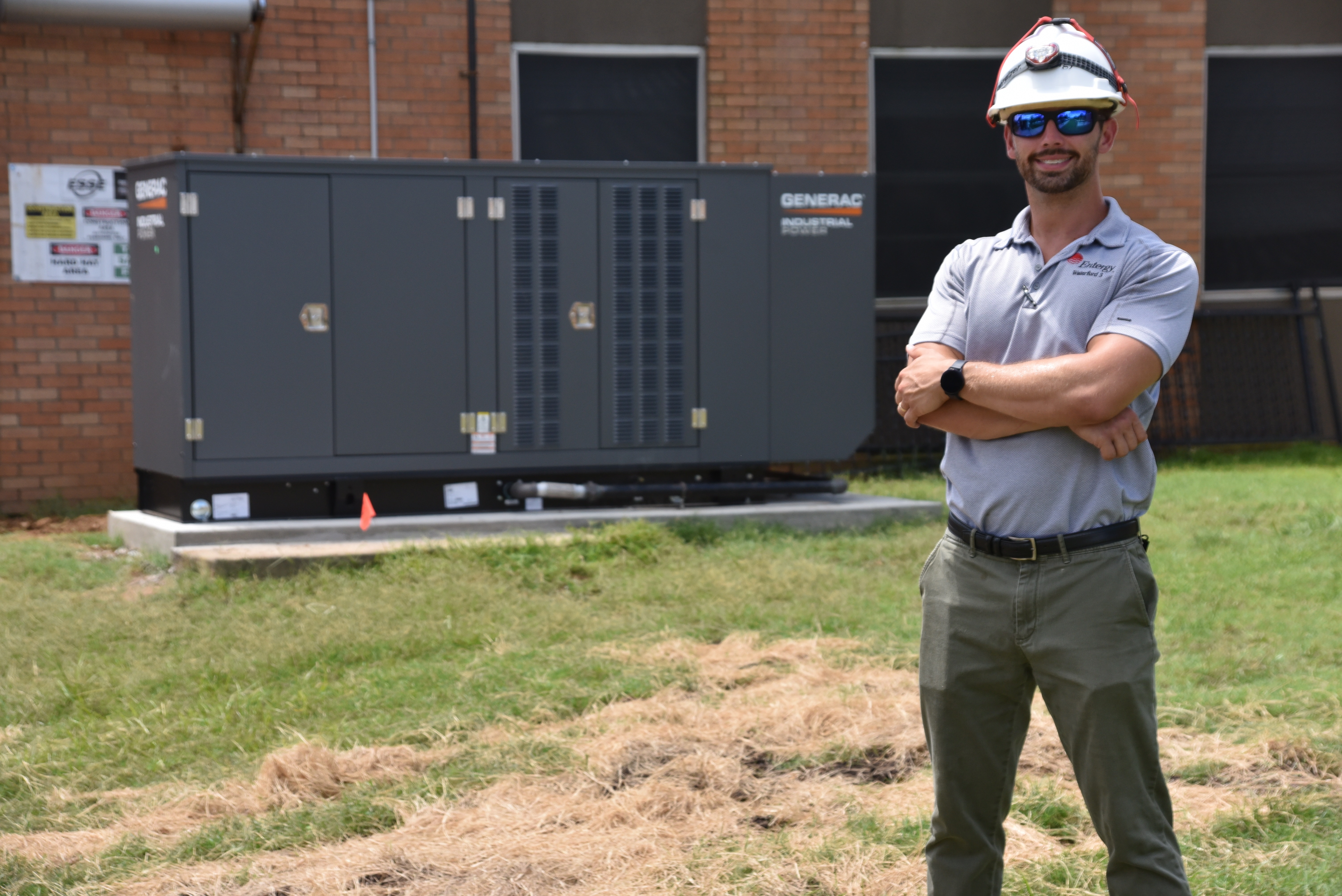Entergy Project Manager Ross Thistlethwaite stands in front of a newly-installed Power Through generator system at Quitman County Health and Rehab in Marks, Mississippi.