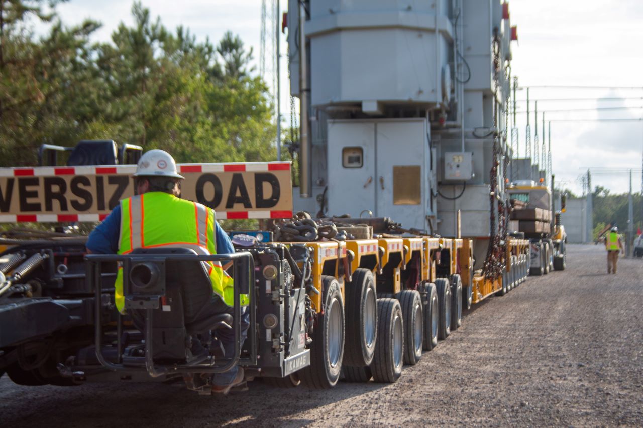 It takes a lot of trucks and a lot of manpower to move massive pieces of equipment like this to the restoration site.