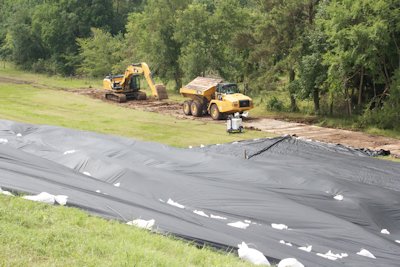 The company has performed an initial inspection of the dam and has confirmed that there is no breach and no visible damage. The protective coverings remain in place.