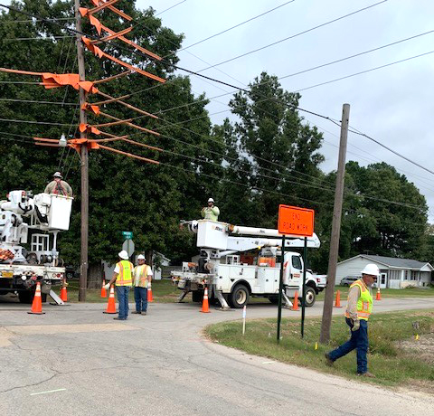 Crews repair power poles and transmission lines in Corning to provide better reliability and quality electricity.
