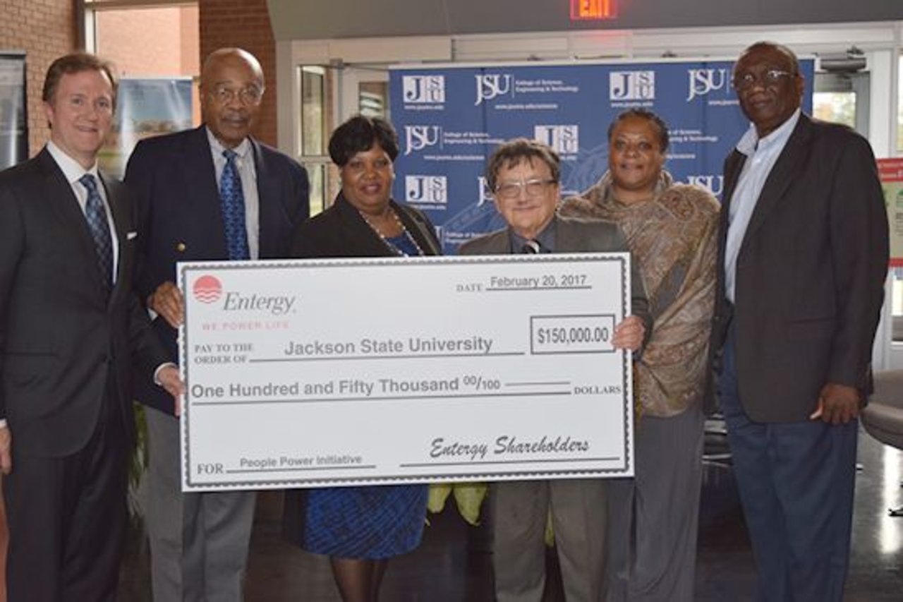 Haley Fisackerly (far left) presents Entergy's donation to JSU officials Dr. Rod Paige, Sandra Hodges, Dr. Richard Aló, Angela Getter, and Dr. Mahmoud Manzoul.
