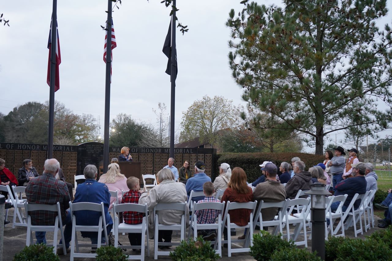  Mayor Caroline Wadzeck speaks to Dayton residents at the Wall of Honor Memorial.